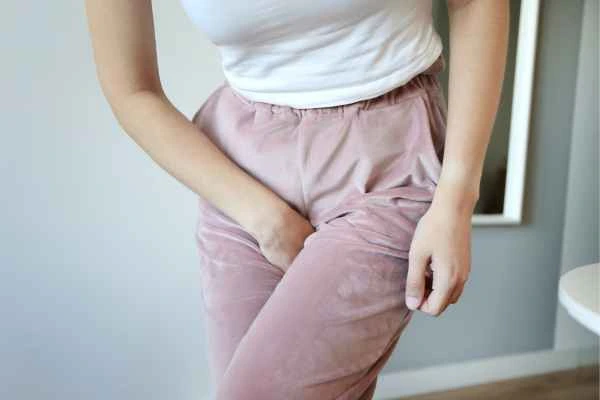 woman running for the toilet because of urinary incontinence Newcastle-under-Lyme